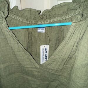 Brand new with tags olive green gauze materiall ruffled sleeveless shirt